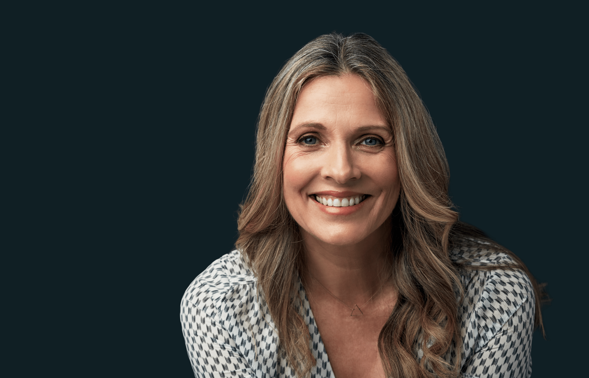 Close up of a woman leaning in and smiling