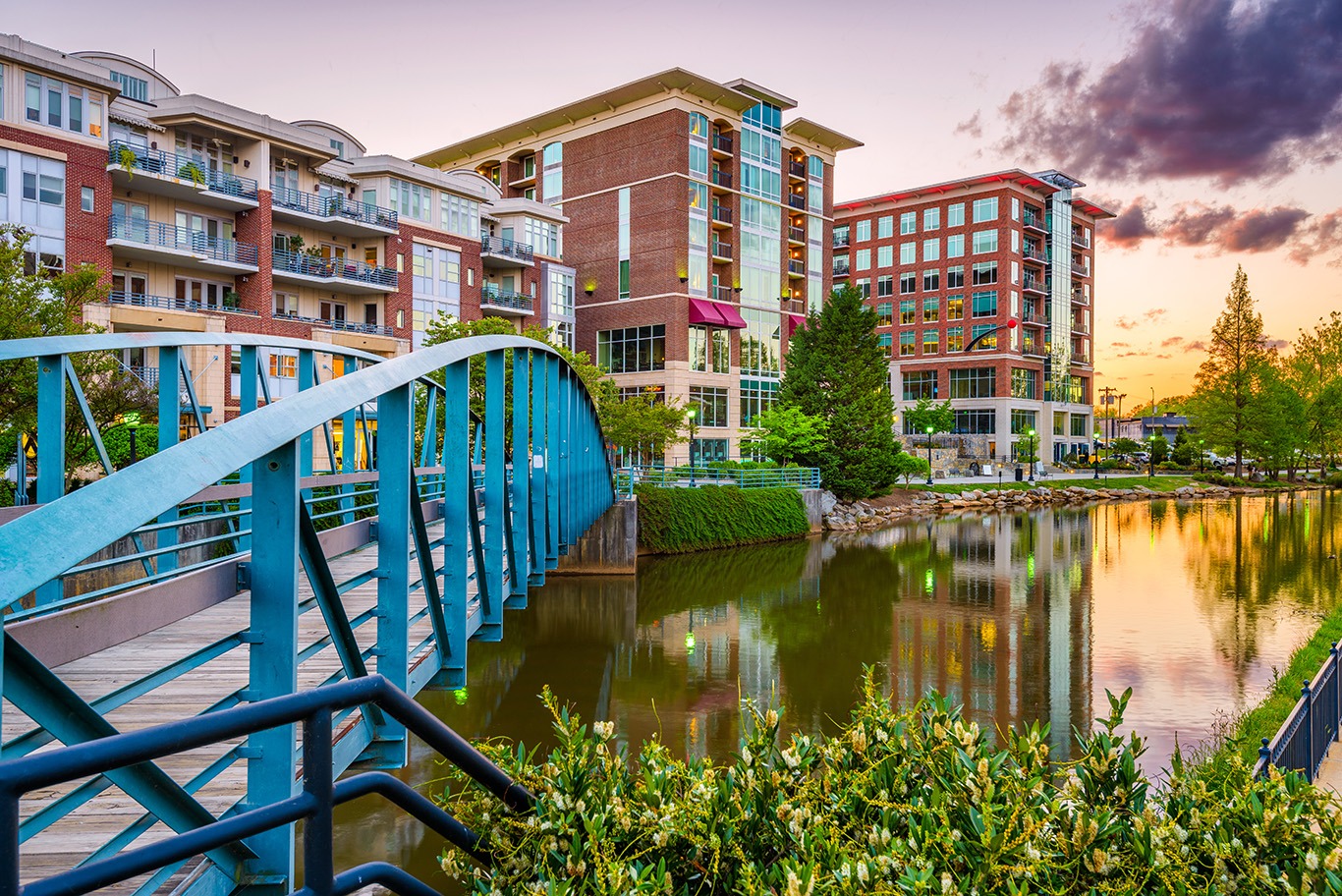 Greenville, South Carolina, USA downtown cityscape on the Reedy River at dusk Greenville, South Carolina, USA downtown cityscape on the Reedy River at dusk.